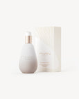 Golden bottle of Mwani Zanzibar’s Facial Cleanser & Mask, next to exterior packaging.