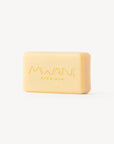 Bar of a creme colored soap with Mwani Zanzibar logo engraved.